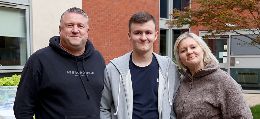Liverpool Hope student with parents outside of their accommodation
